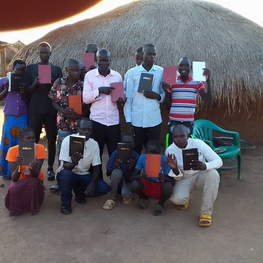 Believers receiving Bibles in the busia koboko 