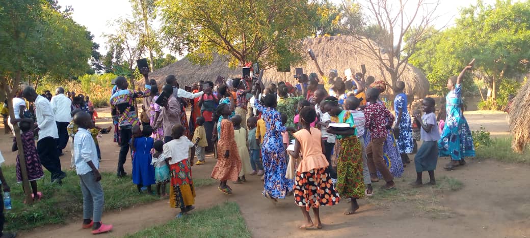 Rejoicing over receiving Bibles in one of the refugee camps.